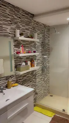 a bathroom with a shower and a sink and a mirror at HOURIA LOC Marrakech in Marrakech