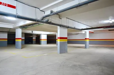 an empty parking garage with columns and pipes at apart in the centre of marrakech gueliz in Marrakech