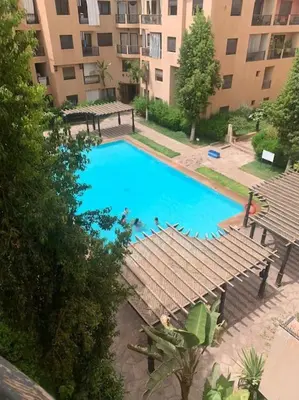 an overhead view of a swimming pool in a building at Confort et Style Studio Chic avec Piscine in Marrakech