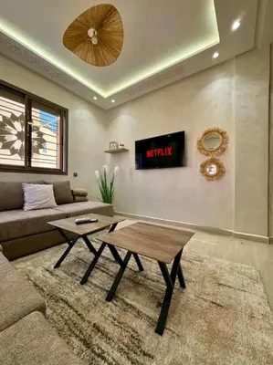 a living room with a couch and a coffee table at Yumo - Cozy 2 in Marrakech