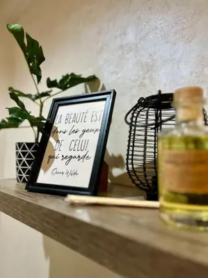 a shelf with a picture and a bottle on it at Yumo - La Vida in Marrakech