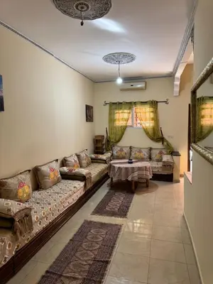 a living room with couches and a table at TOP couple apartment in Marrakech
