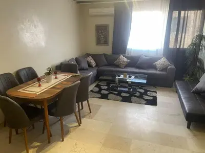 a living room with a couch and a table at Appartement de Lux,Guèliz in Marrakech