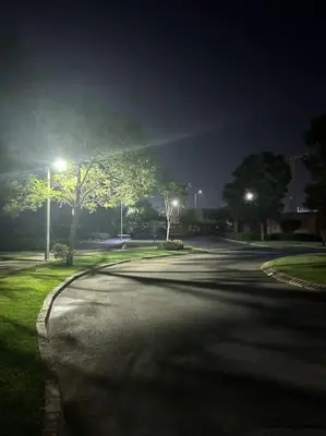 an empty street at night with street lights at GOLF PRESTIGIA Résidence TOPAZE in Marrakech
