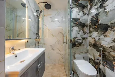 a bathroom with a sink and a shower at VISTA HOLIDAYS ctm in Marrakech