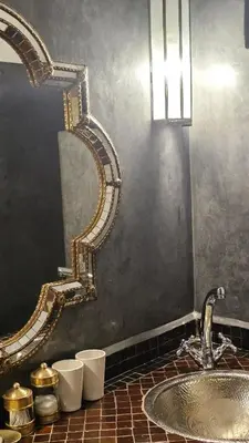 a bathroom with a sink and a mirror at Riad Clefs d'Orient in Marrakech