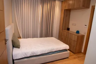 a small bedroom with a bed and a window at Villa 