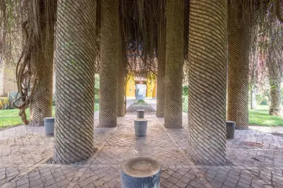a row of trees in a pavilion with trees at Super cosy fully equip - pool - prox. M Avenue in Marrakech