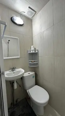 a small bathroom with a toilet and a sink at Riad Jasmine SYBA in Marrakech