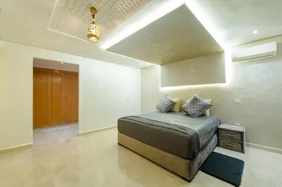 a bedroom with a bed in a room at Charming City Getaway in Marrakech