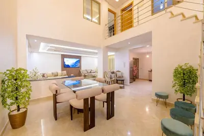 a living room with a table and chairs at Charming City Getaway in Marrakech