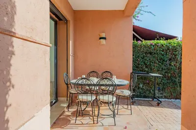 a table and chairs sitting on a patio at Villa Waky Confort & Relax in Marrakech