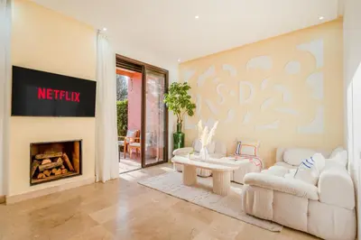 a living room with a couch and a fireplace at Villa Waky Confort & Relax in Marrakech