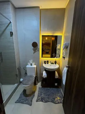 a bathroom with a toilet and a sink and a shower at Appartement confort in Marrakech