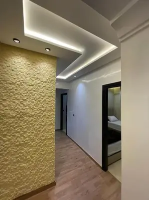 a hallway with a wall with a bed in a room at Appartement à Marrakech au cœur de guéliz in Marrakech