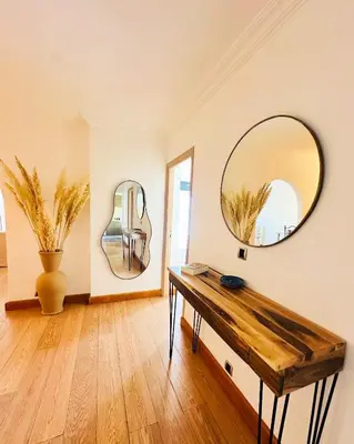 a room with a table and a mirror on the wall at Magnifique 2 chambres Terrasse et Wifi à Marrakech in Marrakech