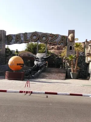 a large sign in front of a building with a basketball at Cozy Apartment in Hay Charaf district, Marrakech in Marrakech