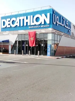 a building with a sign that reads detroit malwegian manufacturer at Cozy Apartment in Hay Charaf district, Marrakech in Marrakech