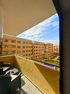 a balcony with a view of a building at La Palmeraie Luxueux avec Piscine et Parking in Marrakech
