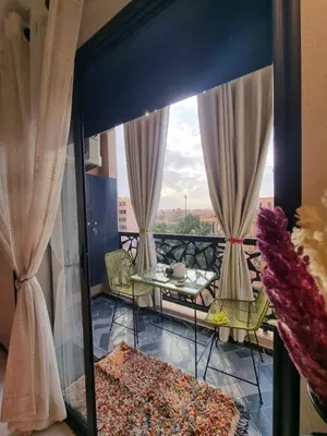 a view of a balcony with a table and chairs at Shine house in Marrakech