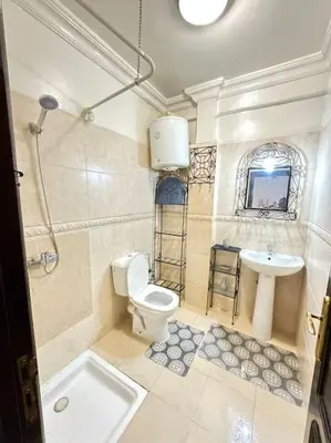 a bathroom with a toilet and a sink at Appart cozy hyper centre calme in Marrakech