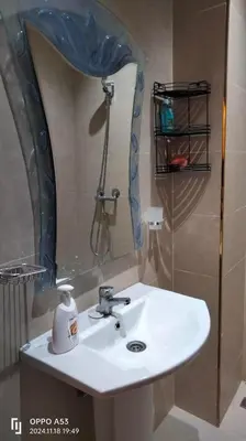 a bathroom with a sink and a mirror at Assala GUÉLIZ in Marrakech