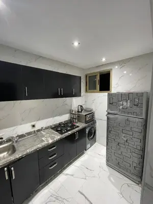 a kitchen with a sink and a stove in it at Assala GUÉLIZ in Marrakech
