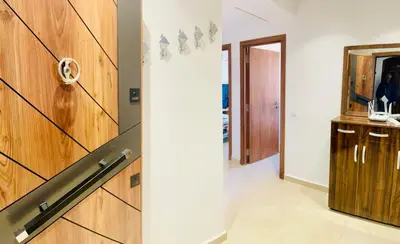 a hallway with a wooden wall and a mirror at Nomad's Cosy Apartment Gueliz Center in Marrakech