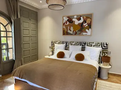 a bedroom with a bed with two teddy bears on it at Villa Ania in Marrakech
