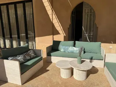 a living room with two couches and a table at Villa Ania in Marrakech