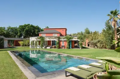 a swimming pool in the yard of a house at Villa à Marrakech in Marrakech