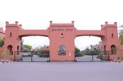 a gate to a building with a gate city at Capstay Riad Villa in secure residence in Marrakech