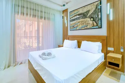 a bedroom with a bed with two towels on it at 17 - Top Location, NEUF, piscine & Comfort in Marrakech