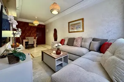 a living room with a couch and a table at Apartment in Centre of Marrakech in Marrakech