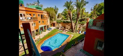 an aerial view of a house with a swimming pool at Riad Mido in Marrakech