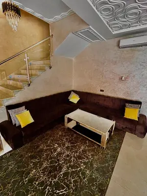 an overhead view of a living room with a couch at Villa à marrakech avec piscine in Marrakech