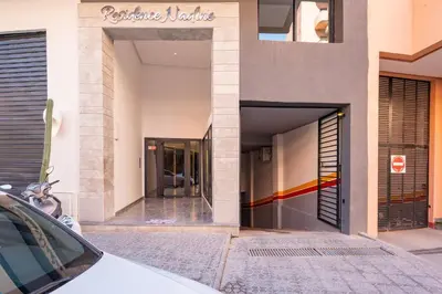 a building with a car parked in front of it at Luxe Urbain - 3 Chambres en Centre-Ville in Marrakech