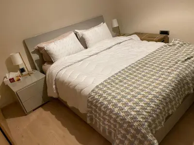 a bedroom with a large bed with white sheets and pillows at Prestigia Aparts de Vacances by Sabor Voyage in Marrakech