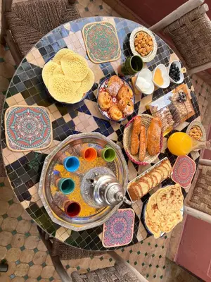 a table with plates of food on top at Un rêve à Marrakech in Marrakech
