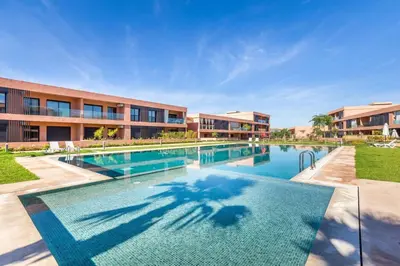 a swimming pool in front of a building at Cute Place for Couple in Love - Pool in Marrakech