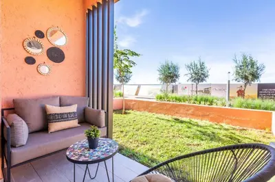 a patio with a couch and a table and chairs at Cute Place for Couple in Love - Pool in Marrakech