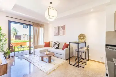 a living room with a couch and a table at Cute Place for Couple in Love - Pool in Marrakech