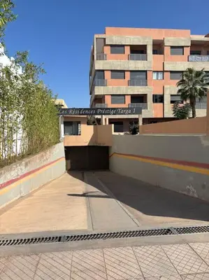 an empty sidewalk in front of a building at Luxury apartment in Marrakech in Marrakech