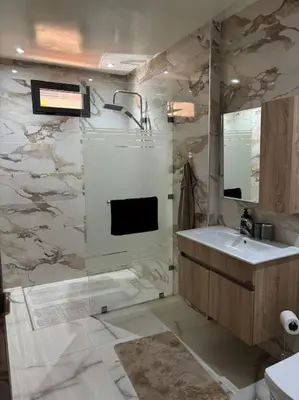 a bathroom with a sink and a mirror at Luxury apartment in Marrakech in Marrakech