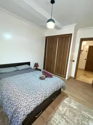 a bedroom with a bed in a room at Chic appartement marrakech in Marrakech