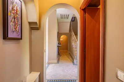 a hallway with an archway in a home at Villa Riad Targa 10 min de GUELIZ Piscine privee in Marrakech