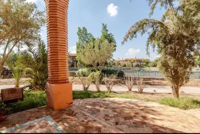 a pole sitting on top of a brick patio at NATURALapartmentLARGE pool in Marrakech