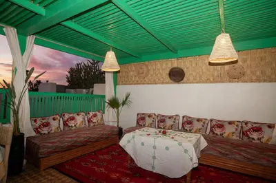 a living room with a couch and a table at riad dar wlidati in Marrakech