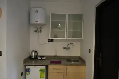 a small kitchen with a sink and a counter at Bayt Al Atlas in Marrakech