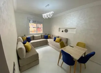 a living room with a couch and a table at Maison lala in Marrakech
